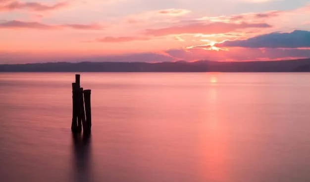 A serene image of a sunset over a calm ocean, symbolizing peace and gratitude for the beauty of nature.