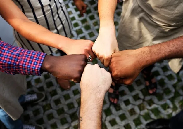 A group of diverse people supporting each other, symbolizing the importance of social connections and community in building resilience.