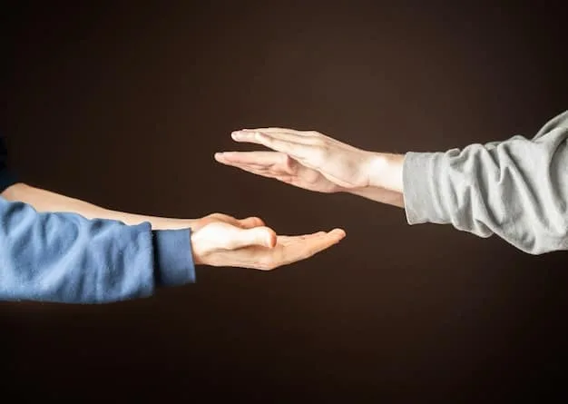 A person is shown reaching out their hand in support to another person who appears distressed. The background is blurred, emphasizing the connection and empathy between the two individuals. The lighting is warm, conveying a sense of hope and comfort.