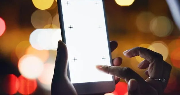 A close-up of a hand holding a smartphone. The screen displays a social media feed filled with idealized images and perfect lives, emphasizing the potential for social comparison and feelings of inadequacy.