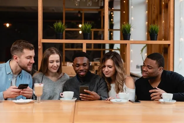 A diverse group of people laughing and talking face-to-face in a coffee shop, without any smartphones in sight. The scene represents genuine connection and offline interaction.