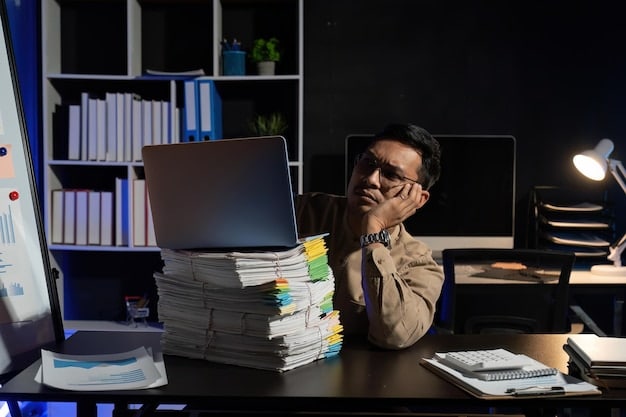A person sitting at a desk looking stressed and overwhelmed, surrounded by piles of papers and a computer screen, with soft, diffused lighting.
