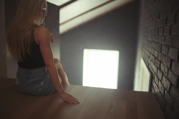 A close-up of a person sitting in front of a light therapy box, with a soft, diffused light illuminating their face. They appear relaxed and content, suggesting the positive effects of light therapy on mood.
