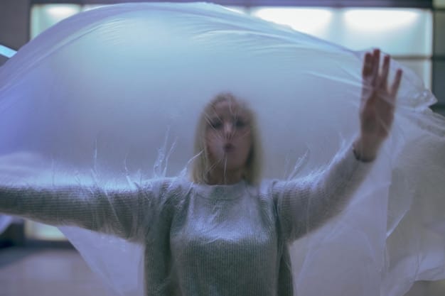 A person tossing and turning in bed, unable to sleep, with thoughts seemingly racing in their head, representing the struggle with insomnia and its impact on mental well-being.