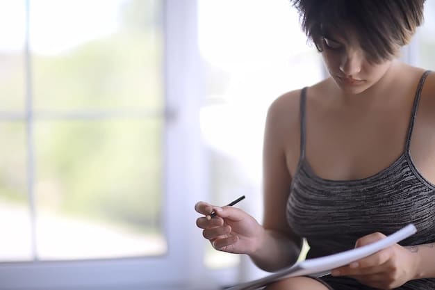 A person using a habit tracking app on their phone, with a calendar view showing consistent progress on workout days.