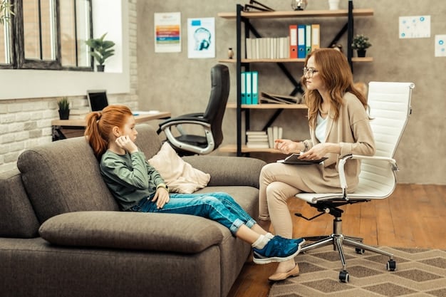A school counselor sitting in a comfortable office, talking compassionately with a young student. The counselor is actively listening, and the student appears to be opening up and sharing their feelings. The setting is warm and inviting.