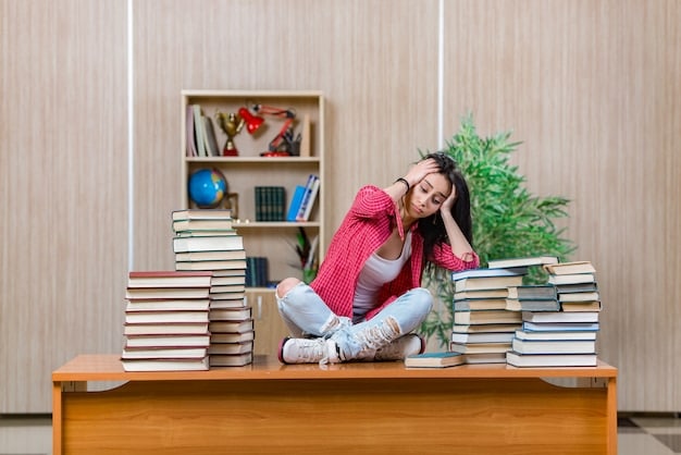 A young student looking tired and overwhelmed, sitting at a desk with textbooks and a laptop. The desk is cluttered, and the overall scene conveys the pressures of academic life combined with digital distractions.