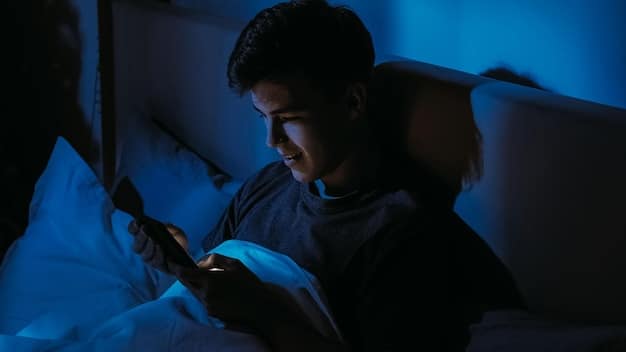 A person using a smartphone in bed late at night, with the blue light from the screen illuminating their face. The background is dark and the scene should convey a sense of isolation and sleep deprivation.