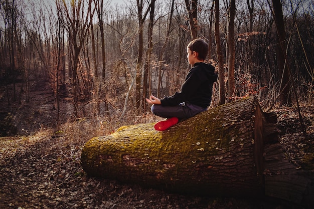 A person meditating peacefully in a quiet space, surrounded by nature. The image emphasizes mindfulness and the importance of managing emotions during challenging times.